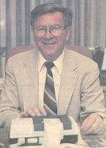 a young Jack Livingstone sits at desk