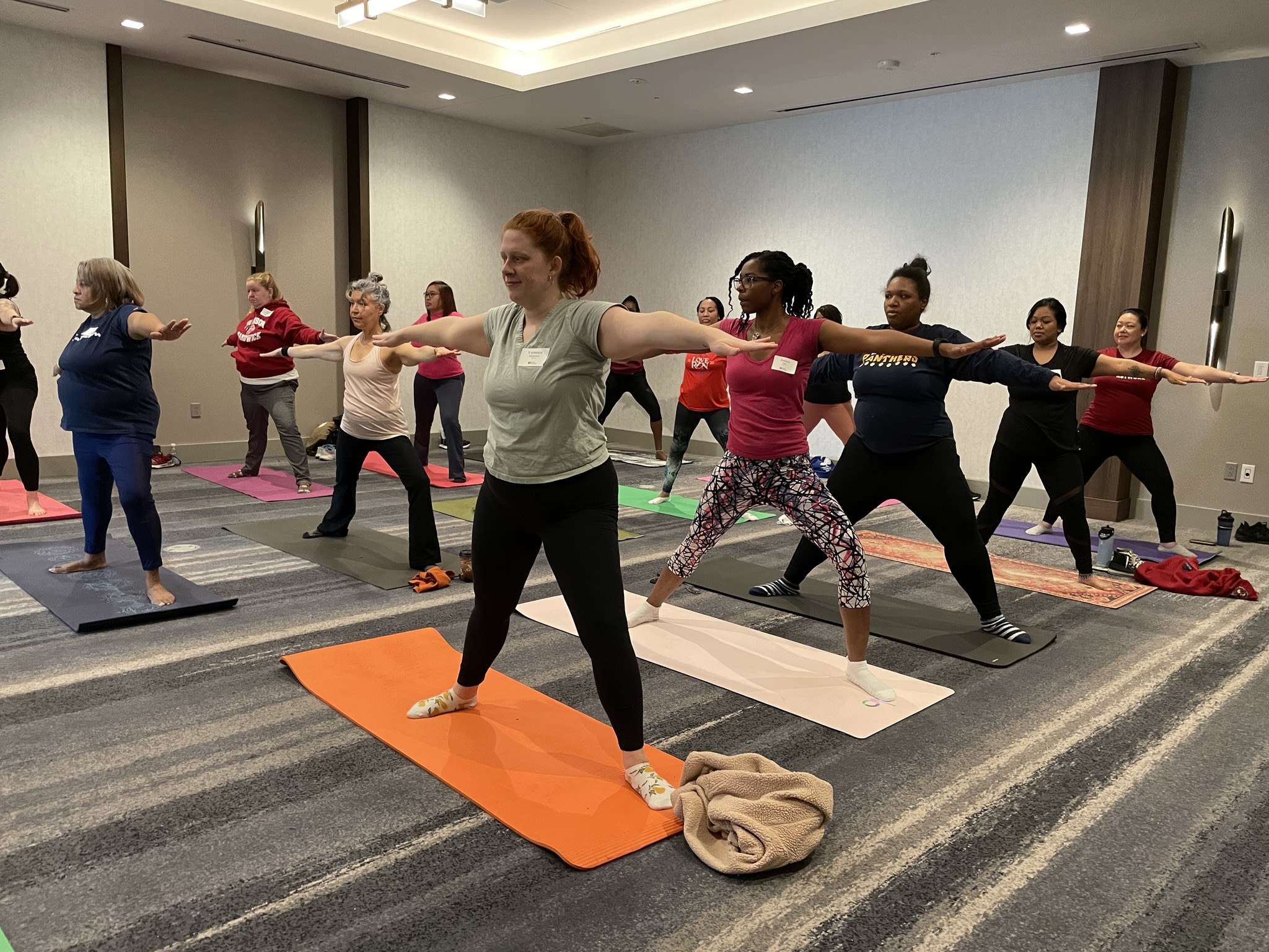 Women doing yoga at the Afterglow Party