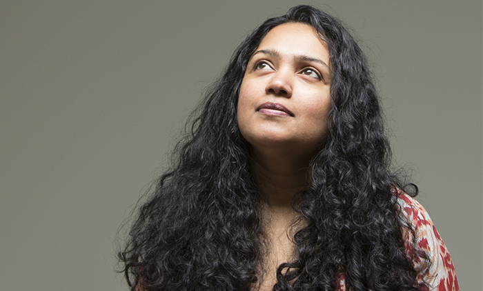 four orange, green, blue, and red paint rollers